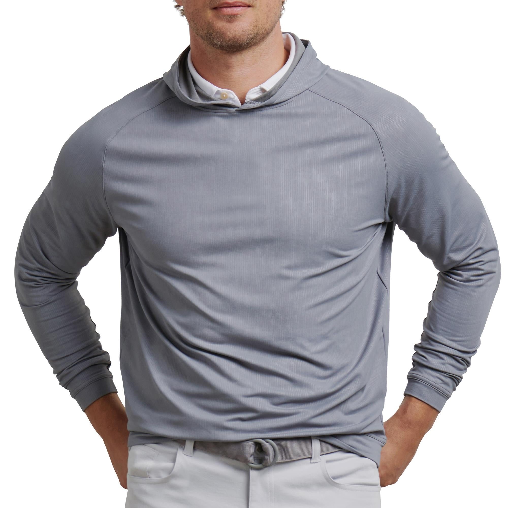 Close-up front shot of model wearing Peter Millar Pine Camo Hoodie – luxury golf clothing for men