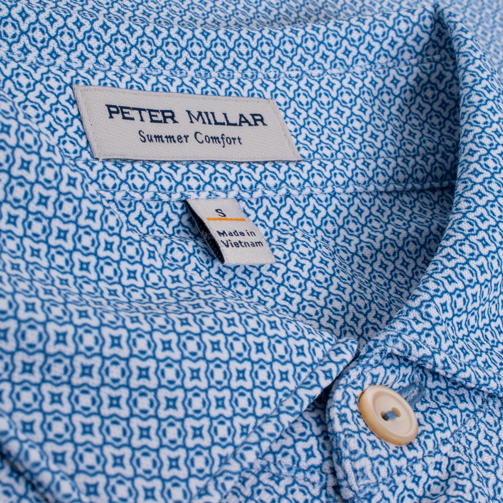 Collar close-up of Peter Millar Costa Geo Polo in Sailor Blue – premium golf polo for men