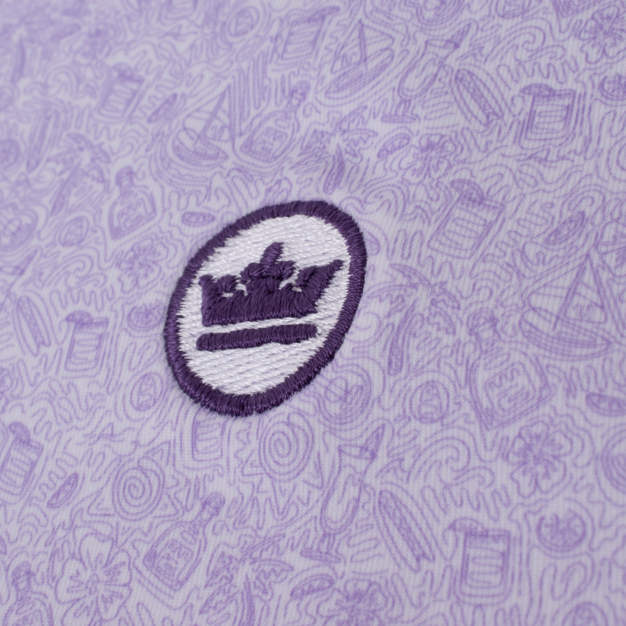 Close-up of Peter Millar logo on chest of Getaway Performance Polo – designer mens golf clothing UK

