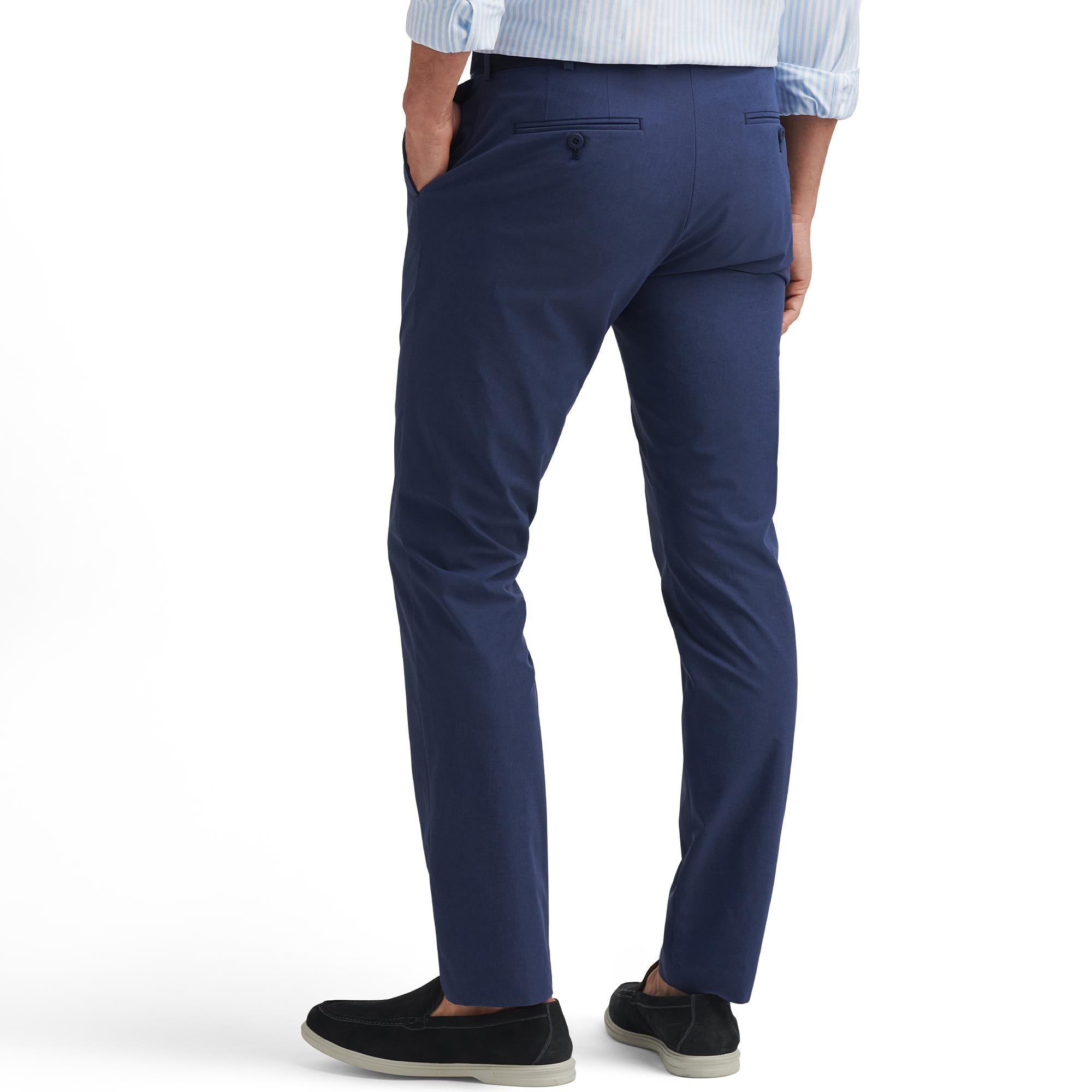Back view of model in Peter Millar Surge Performance Trousers Navy – mens golf pants with stretch