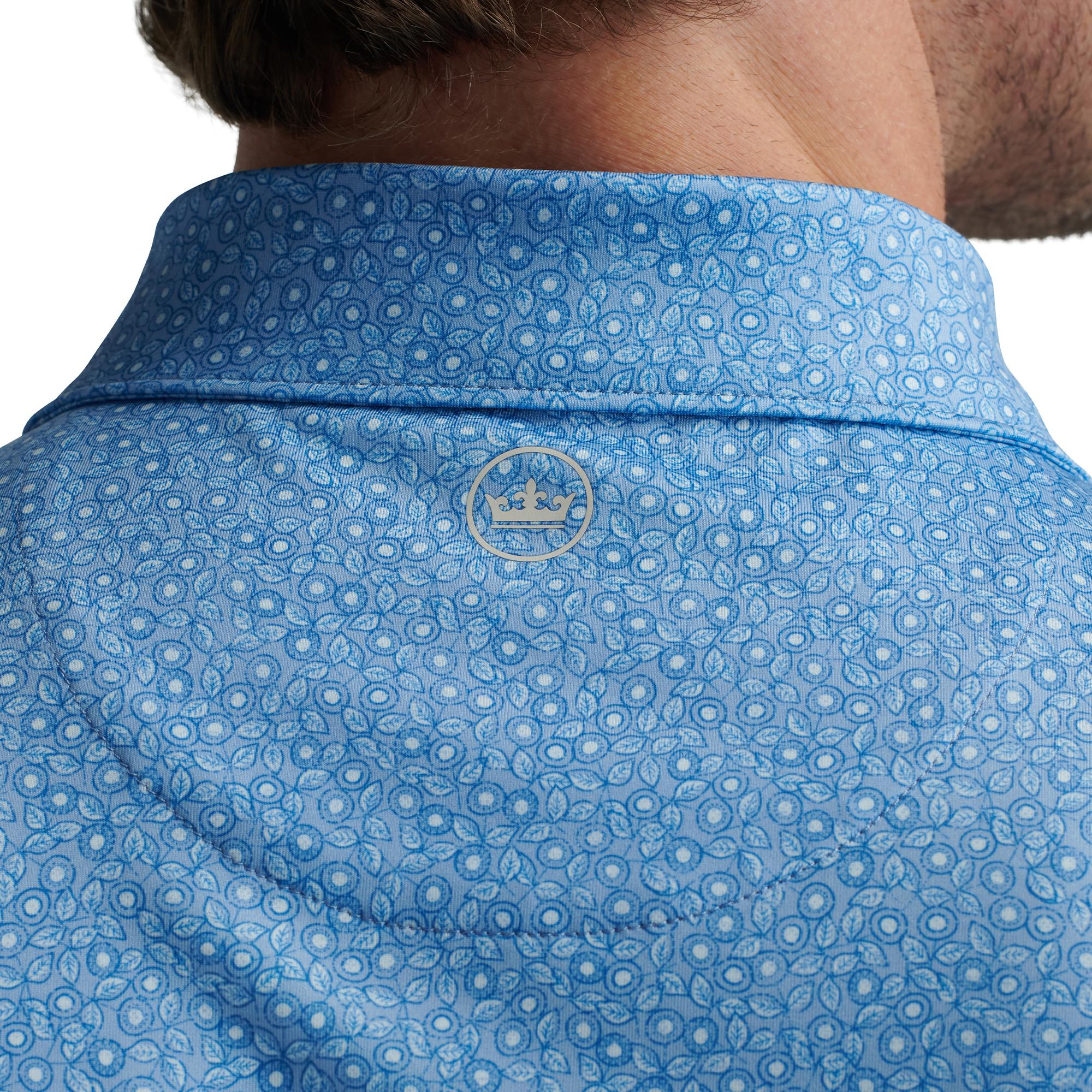 Close-up of logo and back collar on model wearing Peter Millar Bristol Polo Shirt – premium mens golf polo shirt