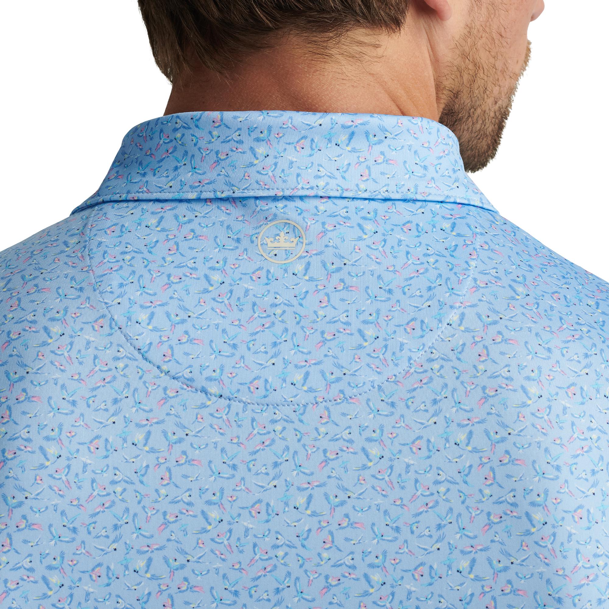 Close-up of Peter Millar logo and back collar on model – luxury mens golf polo shirt