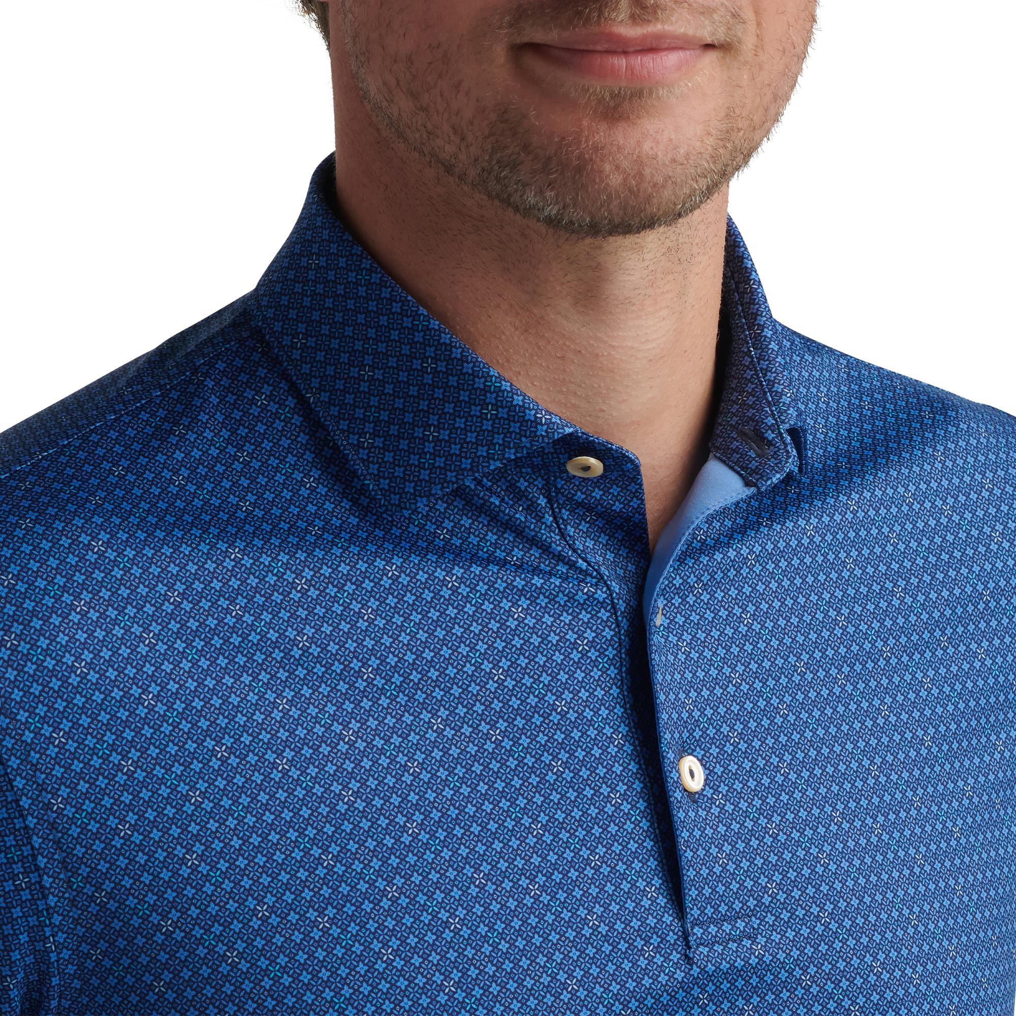 Close-up of model wearing Peter Millar Castellina Polo – collar and button detail on golf polo shirt for men