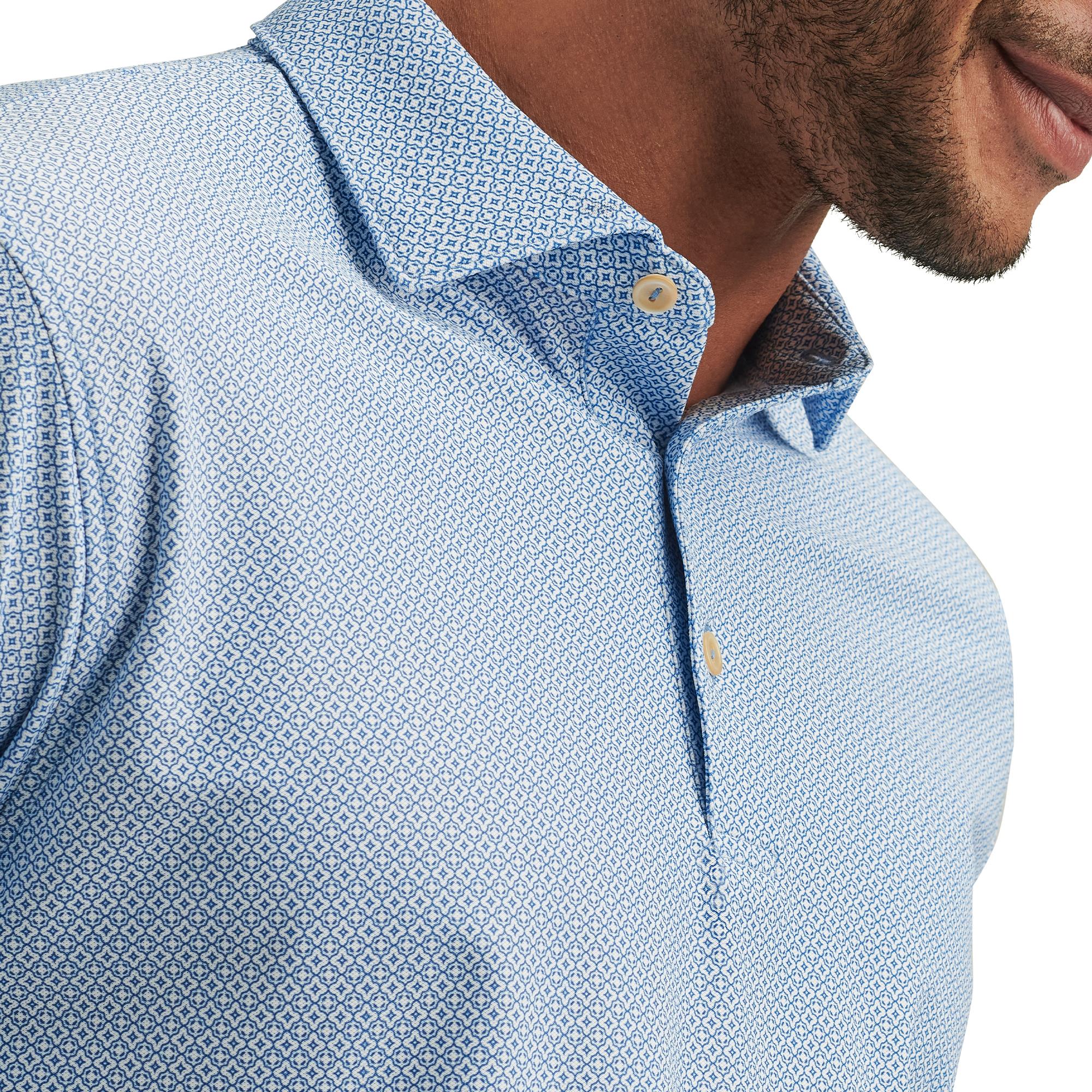 Close-up of collar on model wearing Peter Millar Costa Geo Polo Shirt – mens golf polo shirts UK