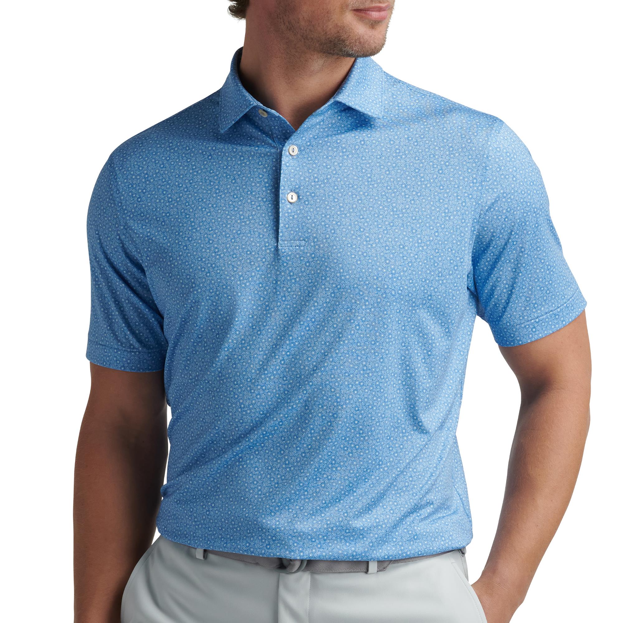 Male model wearing Peter Millar Bristol Floral Performance Jersey Polo Shirt in Blue Fade – stylish mens golf polo