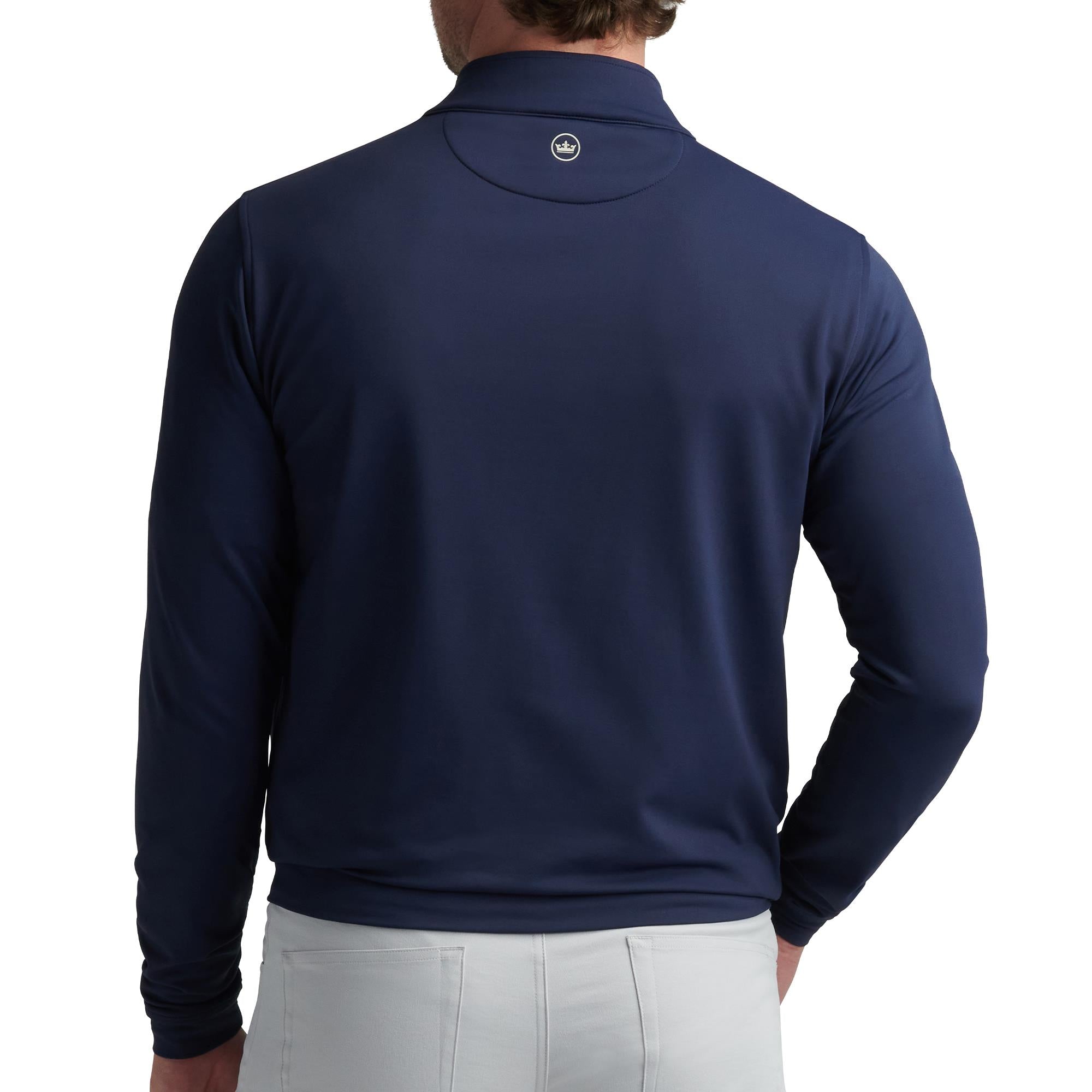 Back view of model in Peter Millar Navy 1/4 Zip – luxury golf midlayer and performance layering for men