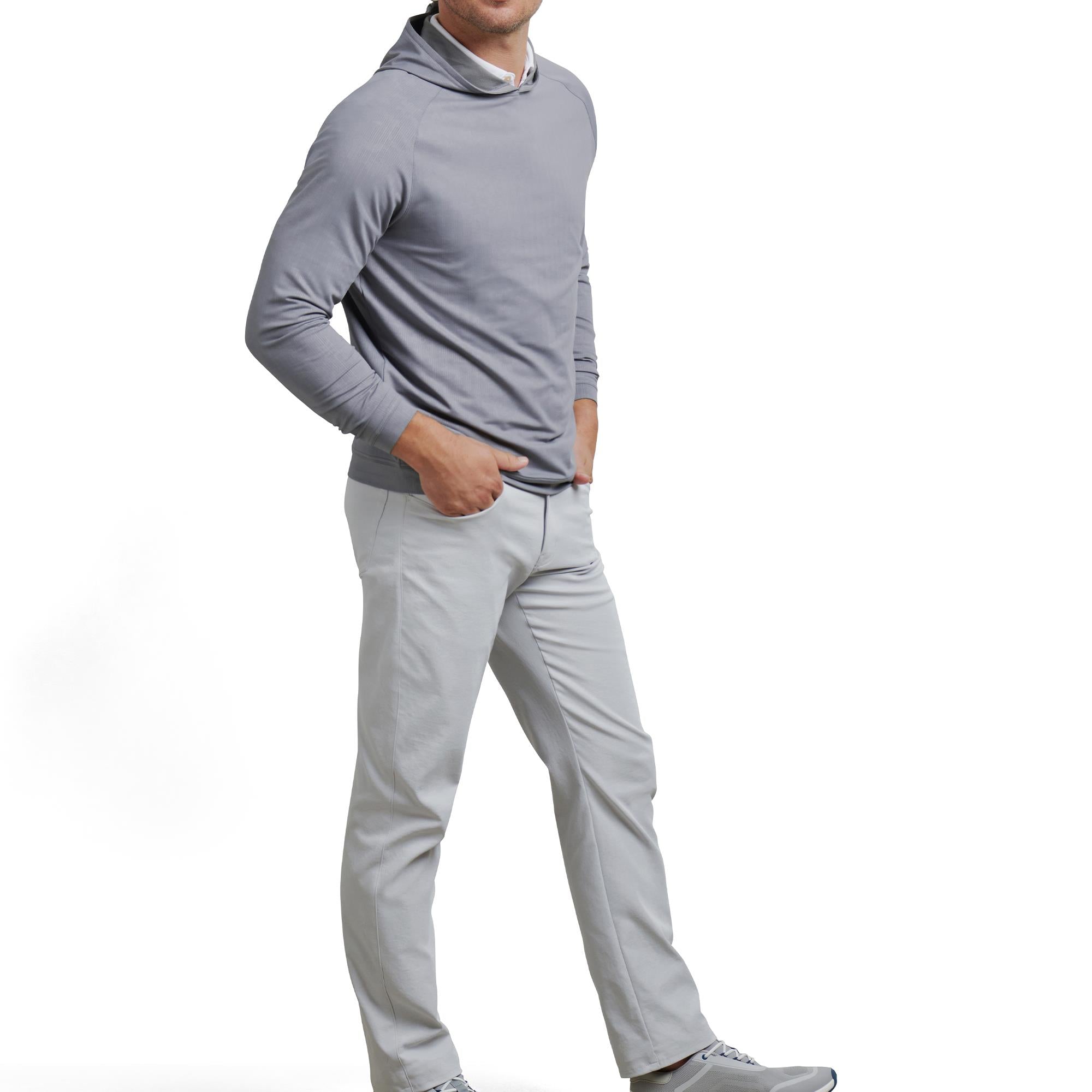 Male model wearing Peter Millar Pine Camo Performance Hoodie in Blue Oslo Grey – premium mens golf hoodie