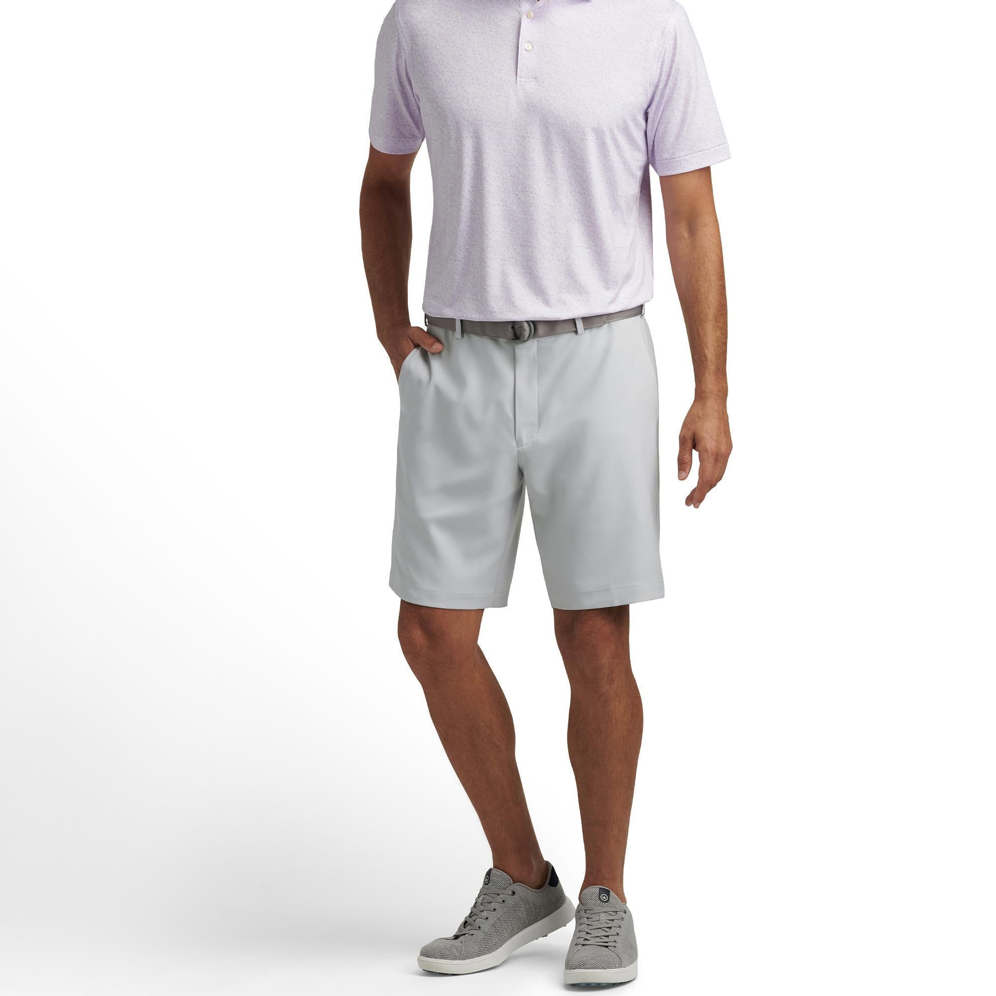 Model front view wearing Peter Millar Salem High Drape Performance Shorts in British Grey – mens golf shorts