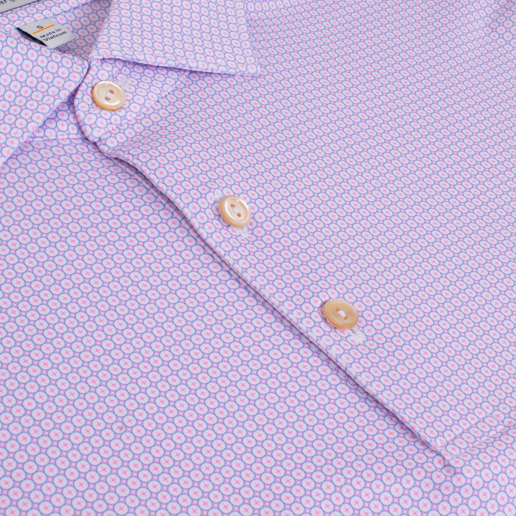 Close-up showing fabric pattern and button detail on Peter Millar Solid Polo Shirt – mens golf polo