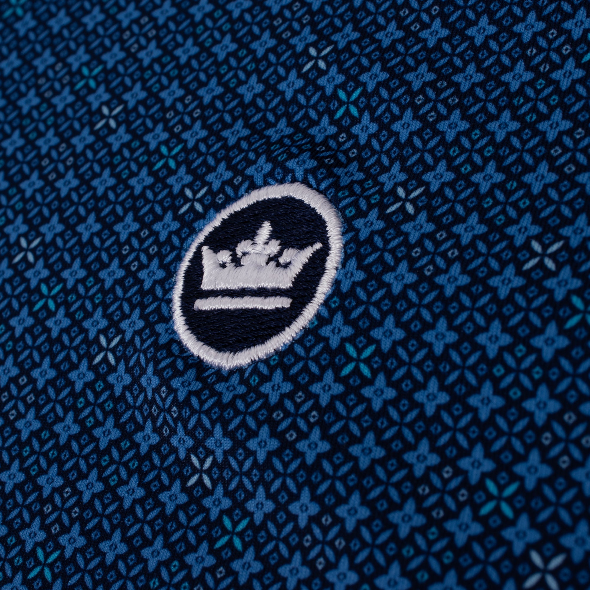 Embroidered Peter Millar logo on chest of Castellina Performance Jersey Polo – premium mens golf clothing