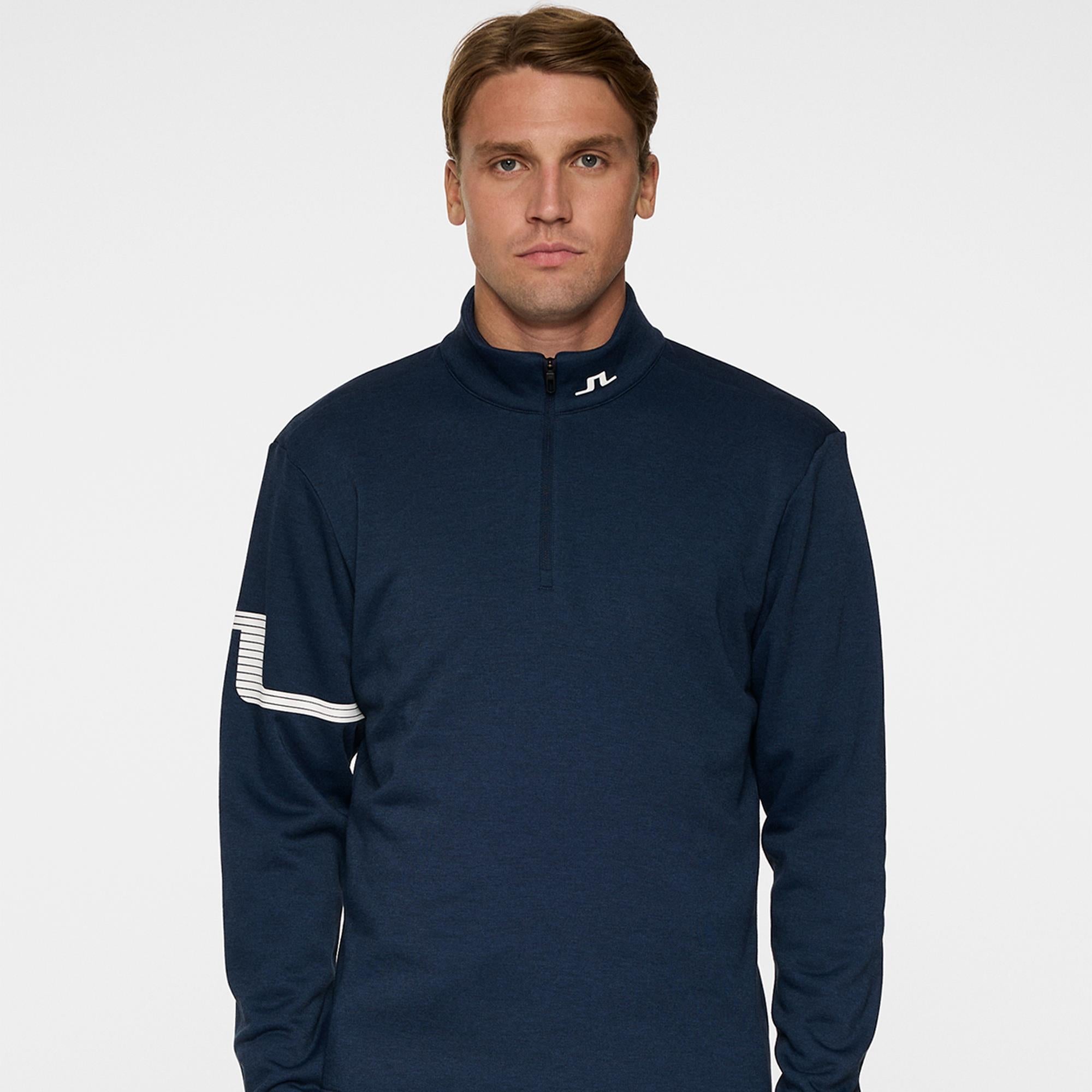 Model front view in J.Lindeberg Heath Strike Golf Mid Layer Navy