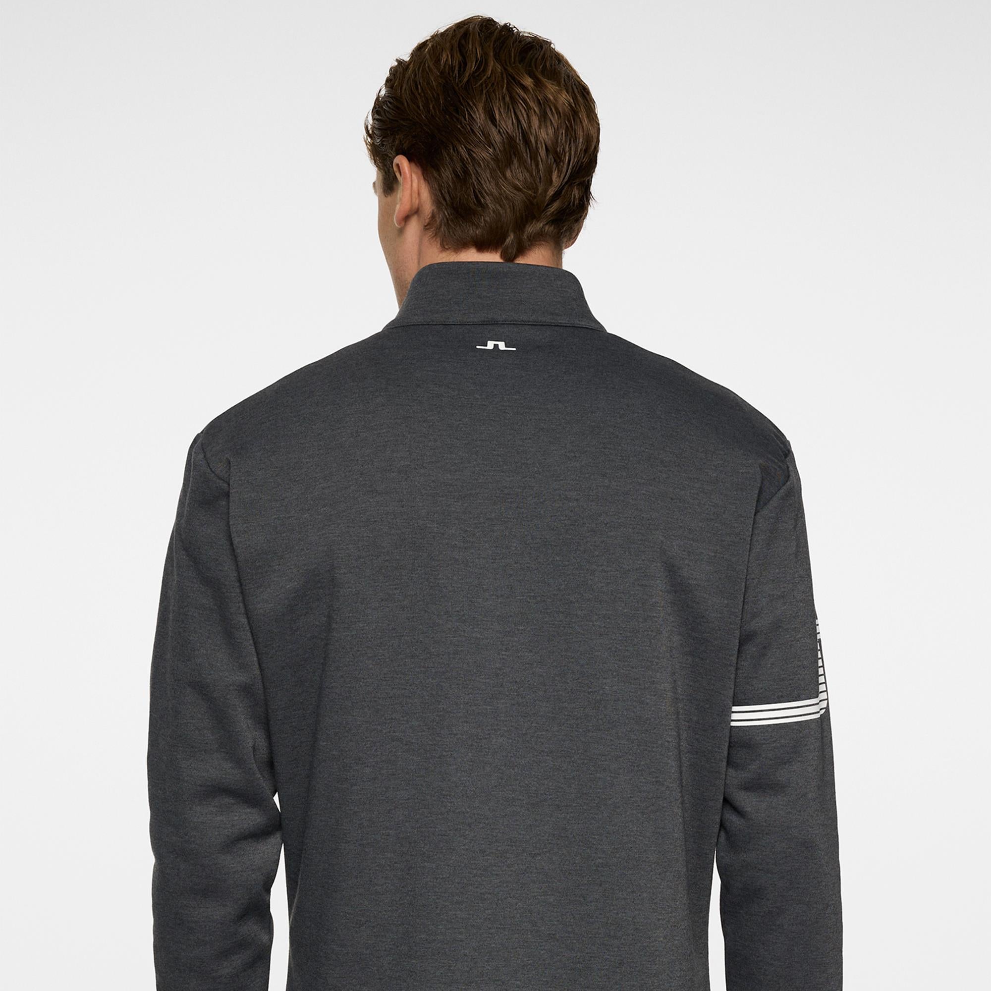 Model back view in J.Lindeberg Heath Strike Golf Mid Layer in Asphalt