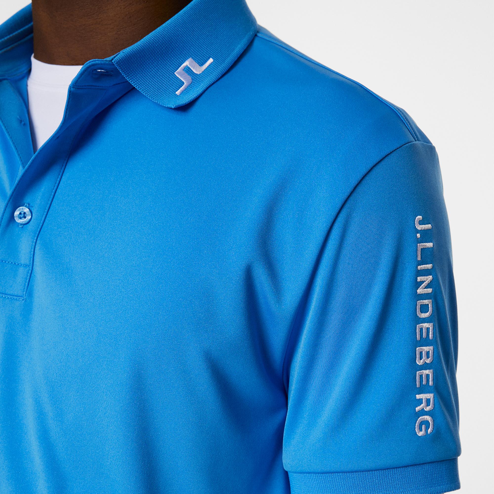 Close-up of collar and sleeve details on J.Lindeberg Tour Tech Polo – Sonic Blue