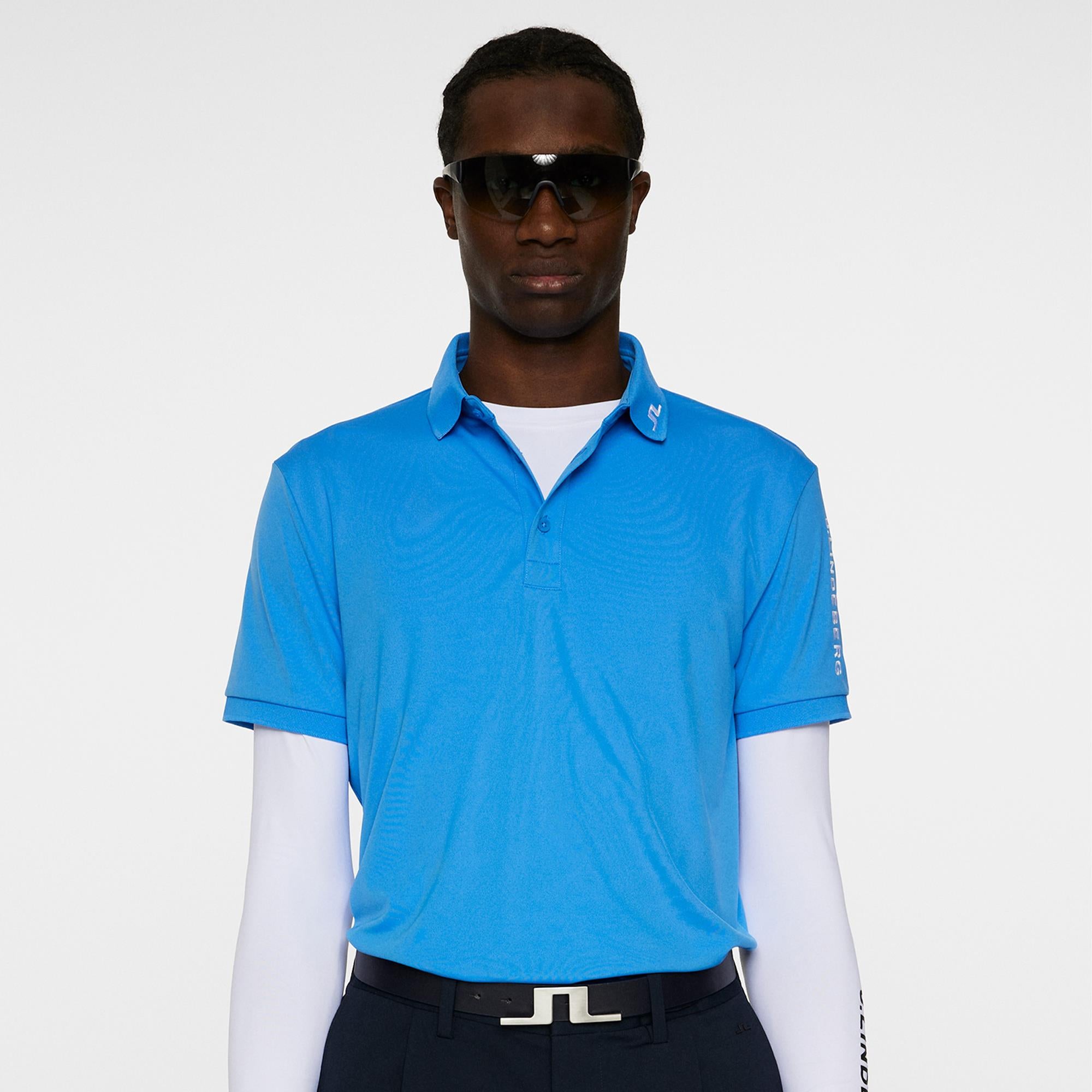 Front view of model in J.Lindeberg Tour Tech Polo – Sonic Blue
