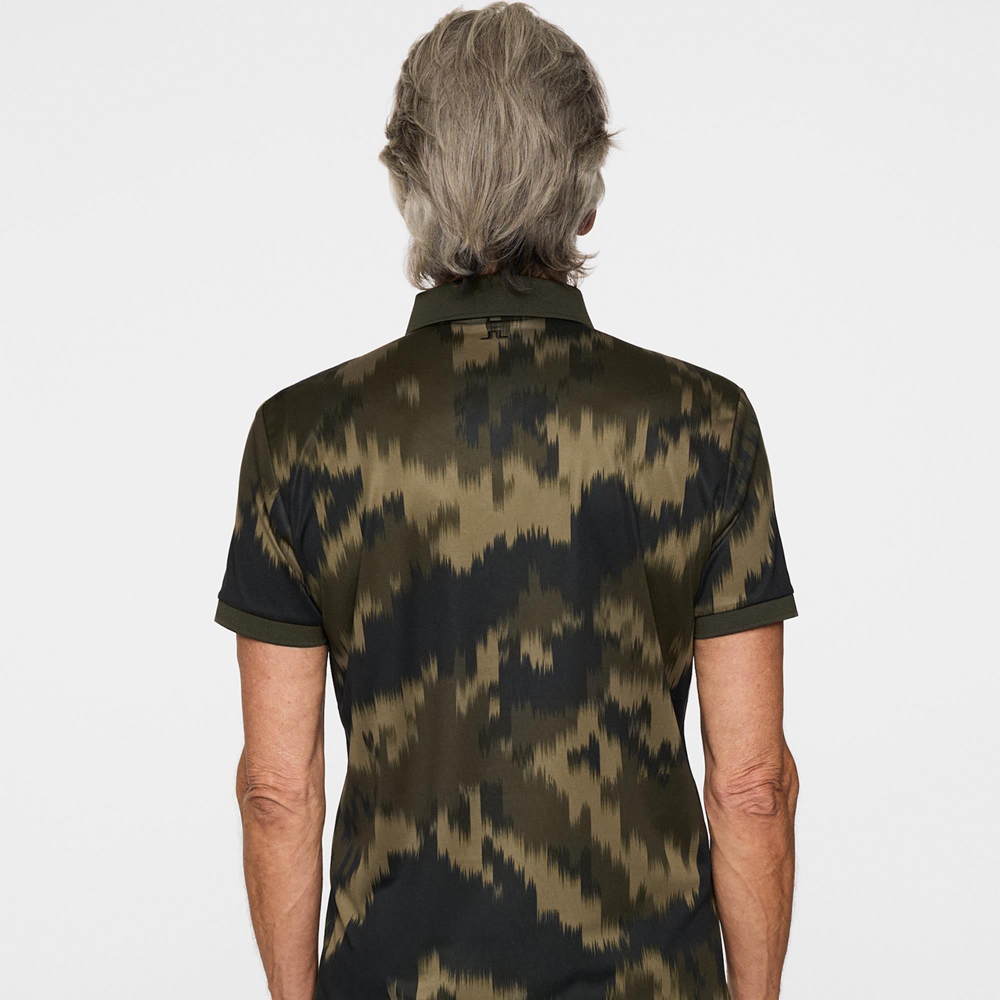 Back view of J.Lindeberg men’s golf polo shirt in Warp Forest, designed for performance and style