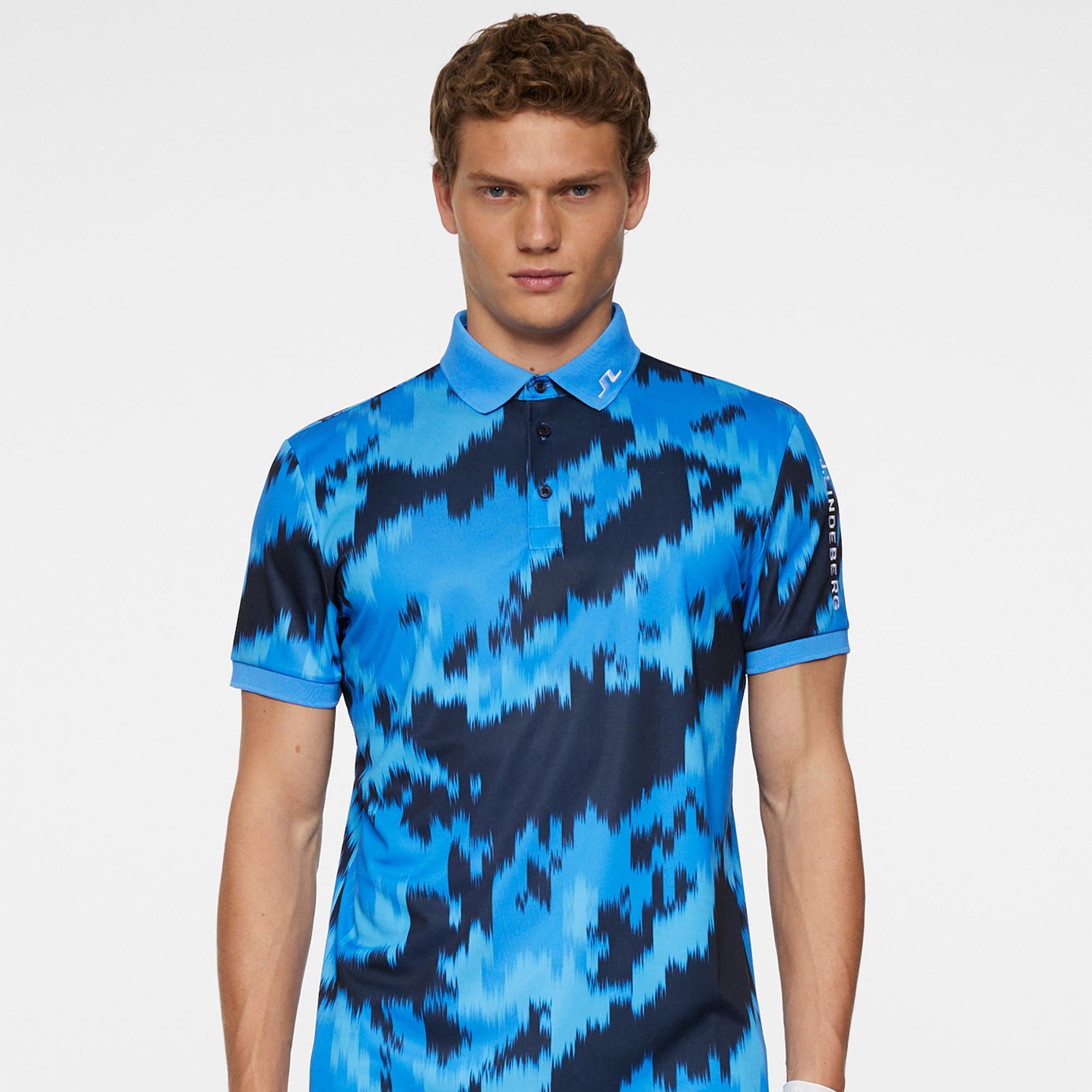 Front model shot wearing J.Lindeberg men’s golf polo shirt Warp Sonic Blue