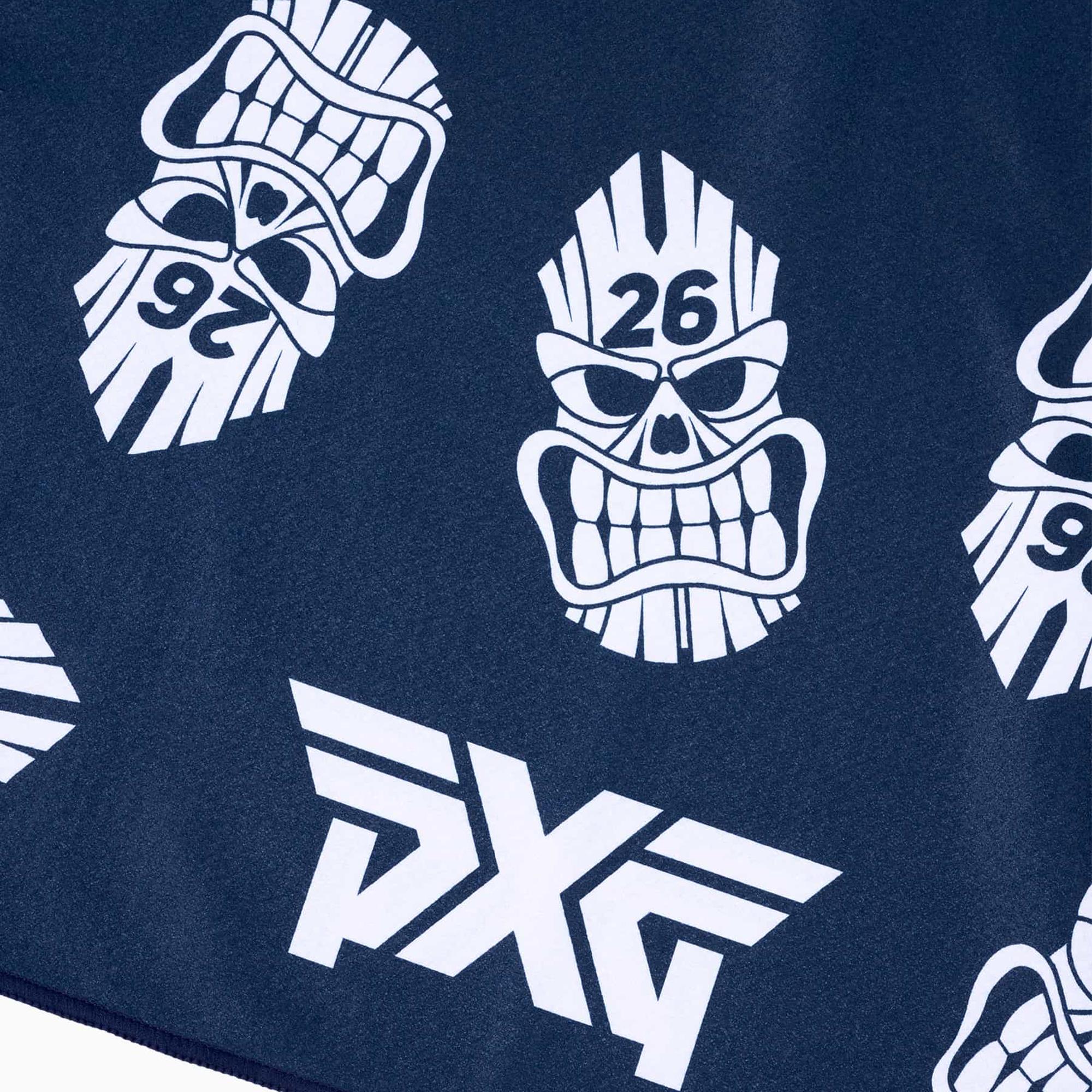 Close-up of PXG logo and Darkness Tiki Skull motif on towel
