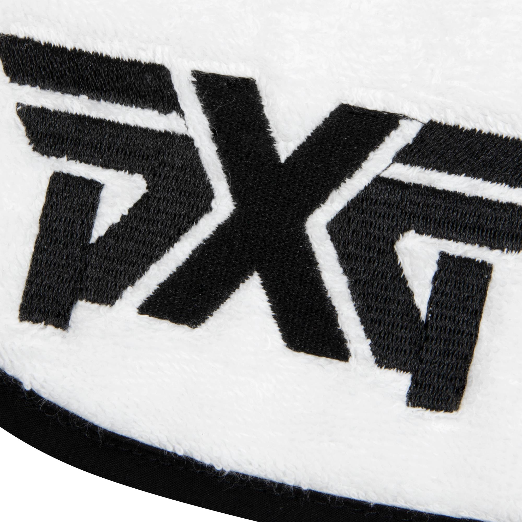 Close-up of black PXG logo on white background on towel

